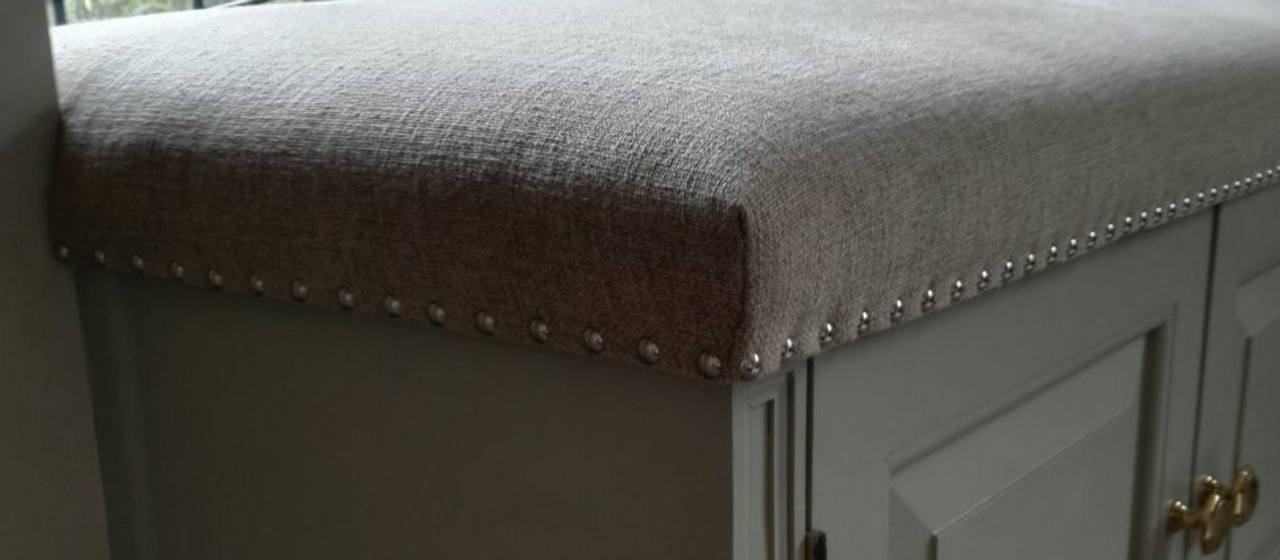 Image of ottoman restored by RH Upholstery