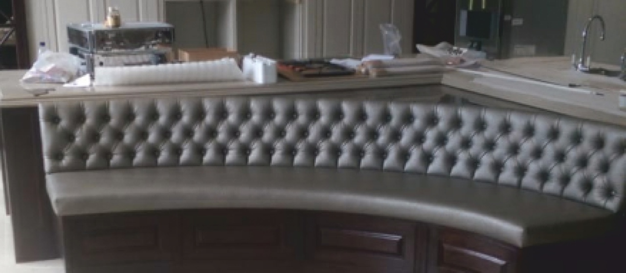 Image of curved leather sofa by RH Upholstery